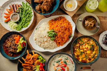 Hari Raya Aidilfitri Ramadan Iftar Dinner Gathering with Traditional Malay Halal Cuisine, Family and Friends Enjoying Festive Food Spread at Home with ayam kurma, curry, nasi briyani and ulam