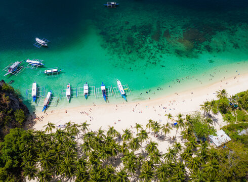 Seven commandos beach in El Nido, Palawan, Philippines islands. Aerial drone view. Top view of beautiful turquoise beach, with white sand and palms