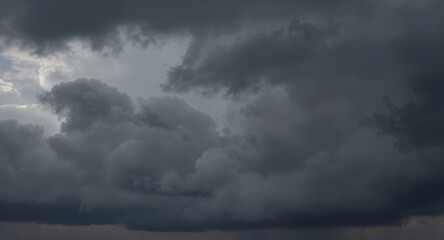 Obraz premium Dramatic Dark Storm Clouds Stock Photo Heavy, Ominous Sky Background