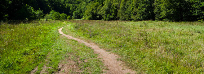 A path that leads through wild countryside. This path is intended only for pedestrians and managers of adjacent land.