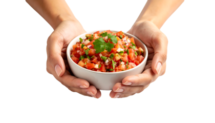 Two hands cradle a white bowl filled with fresh tomato salsa topped with cilantro.