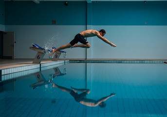 Person diving into swimming pool