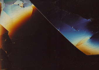 Dust scratches overlay. Blur smashed glass. Cracked black plastic sheet abstract background. Dark gray damaged old screen texture.