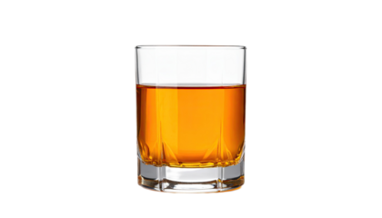 A shot glass filled with amber liquid against a black background.