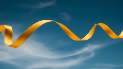 Flowing golden ribbon against a clear blue sky backdrop - Powered by Adobe