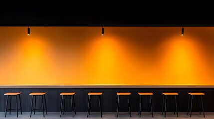 Modern bar with warm orange lighting and stools
