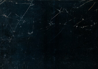 Dusty scratched screen. Grunge black glass. Old distressed dark night texture. Vintage display...