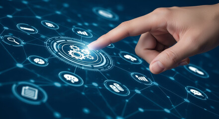 A hand touching a digital icon with gears at the center, surrounded by a network of interconnected technology and business icons on a blue background