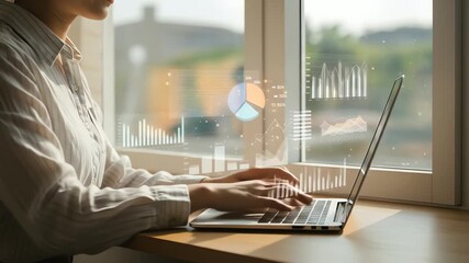 Businesswoman working on laptop with digital charts overlay - Powered by Adobe
