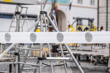warning tape barrier ribbon with fingerprint surround the place with construction tools