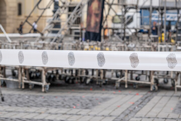 warning tape barrier ribbon with fingerprint surround the place with construction tools