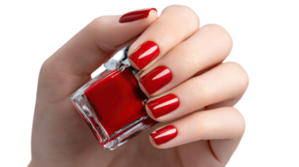 Red Nail Polish in Hand: The scene showcases a close-up view of a hand holding a bottle of vibrant red nail polish, accentuating beauty and fashion elegance.
