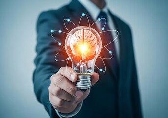 Businessman presents a light bulb with a brain inside symbolizing innovative ideas and creative solutions for business success