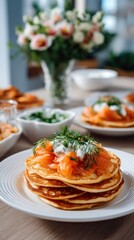 Close-up of pancakes with smoked salmon and cream cheese, with ingredients harmoniously arranged on a serving table with decor 