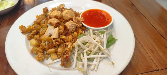 A local food of Phuket Province, Thailand, called O Tao, consists of small oysters coated in flour, fried and seasoned with a unique flavor.