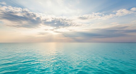 Fototapeta premium Serene Sunrise Over Turquoise Ocean Waters
