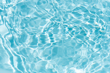 Blue water with ripples on the surface. Defocus blurred transparent blue colored clear calm water...
