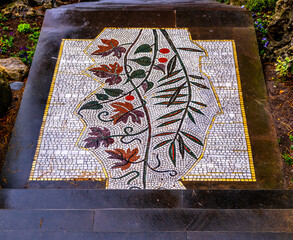 Mosaic pattern on a path in the park.