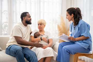 Obraz premium African baby health checkup with doctor pediatrician explaining results to parents, asian mother and african father, family healthcare consultation, childhood health, hospital service, insurance plan