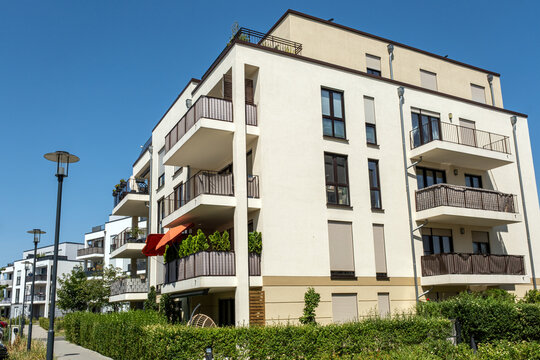 White multi-family residential building seen in Germany