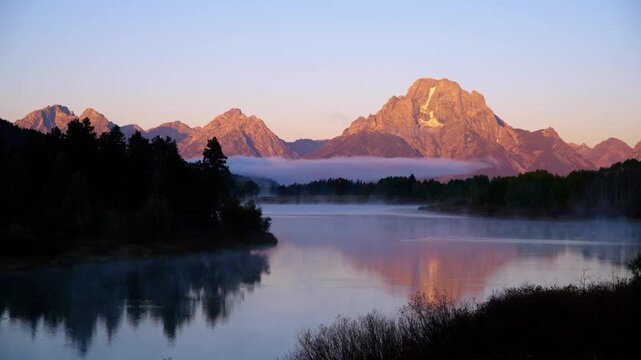 Sunrise alpenglow at Oxbow Bend in Grand Teton National Park, Wyoming.