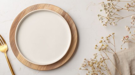 Food styling background with white plate on round wooden board and gold fork on beige linen, warm white surface with generous copyspace