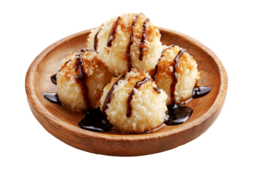 Coconut rice balls or dumplings topped with syrup and shredded coconut on wooden plate, isolated on white transparent background, concept of Polynesian Snacks Faikakai dessert cuisine