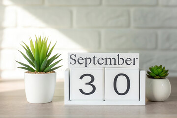 September 30th Calendar Display with Plants Symbolizing End of Month and Time Management for Schedules