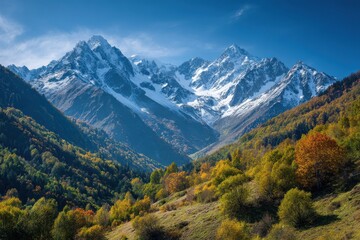 Obraz premium Krasnaya polyana scenic view featuring stunning north caucasus mountains flanked by colorful autumn leaves and fresh snow for adventure seekers and nature photography lovers
