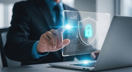 Businessman interacting with a glowing digital security shield and padlock interface on a transparent screen