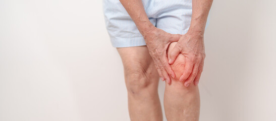 Elderly woman having knee ache and muscle pain due to Runners Knee or Patellofemoral Pain Syndrome,...