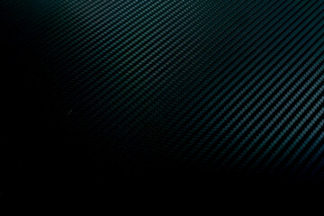 close-up of a carbon fiber pattern, black abstract background