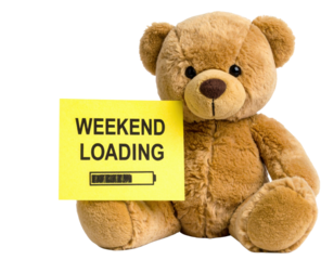 A plush teddy bear holds a yellow sign that reads "WEEKEND LOADING," conveying a playful, whimsical mood.