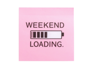 A pink sticky note displays the phrase "WEEKEND LOADING" alongside a battery icon, symbolizing anticipation for the upcoming weekend.