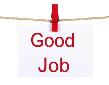 A card with the words "Good Job" printed in red, clipped to a string with a red clothespin.
