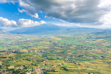 panoramic view of summer season landscape from above of beautiful valley with green fields and blue...