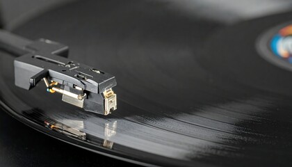 Close-up of a record player's tonearm on a vinyl record