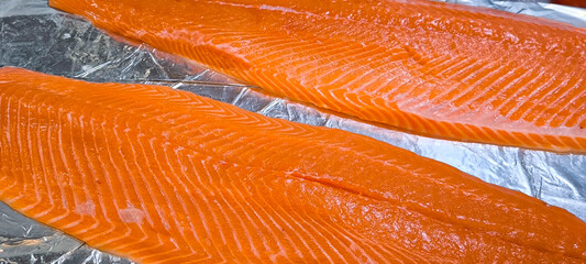Fresh orange salmon fillet at a seafood restaurant