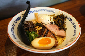 Close up Mazemen, soup-less variety of Japanese ramen made with XO sauce and condiments