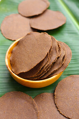 Fermented soybean discs, known as “Thua Nao,” a traditional Thai seasoning used to enhance flavor in Northern cuisine.