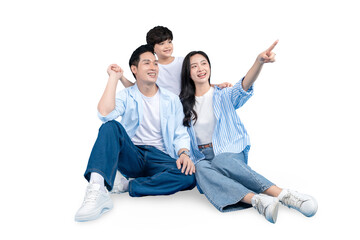 Fototapeta premium A Asian family is enjoying the moment, pointing at something while smiling. The scene evokes warmth and togetherness. The family is composed of three individuals, including a father, mother.