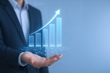 Business Growth Projection: Man Holding a Holographic Bar Graph Displaying Financial Growth in Future Years