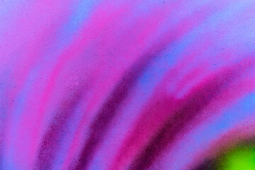 Colorful aerosol street wall background. Urban modern art texture. Wallpaper design backdrop pattern.