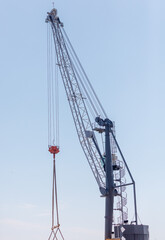 Fototapeta premium A crane is lifting a large object