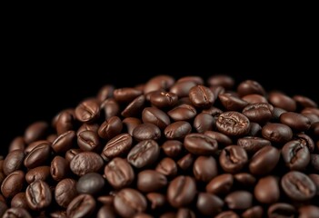 Fototapeta premium Close-up of dark roasted coffee beans against a black background Plenty of copy space, gourmet, coffee industry