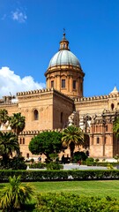 Obraz premium Ancient cathedral, lush gardens