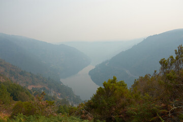 Mirador da Picota in the Peares offers a dramatic view of the Galician valley hidden by smoke from...