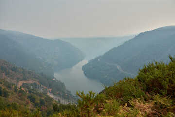 Mirador da Picota in the Peares offers a dramatic view of the Galician valley hidden by smoke from the recent wildfires of 2025