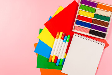 Back to school concept, flat lay of vibrant school or office colorful supplies, school stationery on pink background. flat lay, top view
