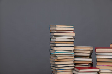 Stacks of old books to study in the library as the background of the university
